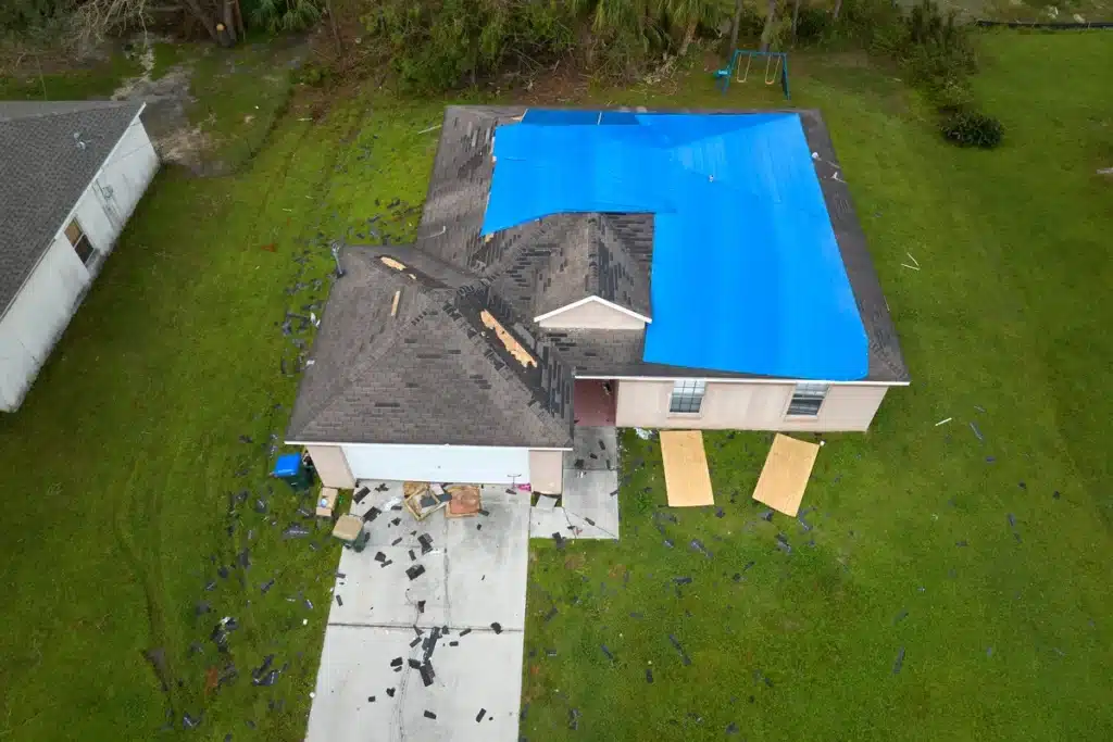 tarped roof and blown off shingles