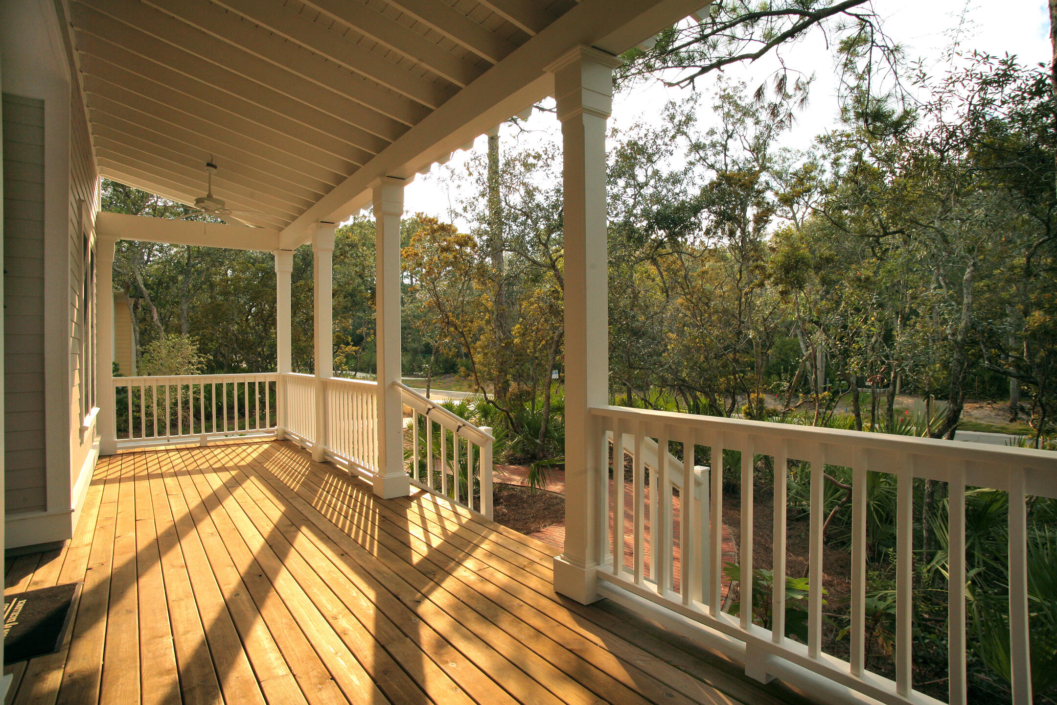 deck railing ideas-house deck with white wooden railing